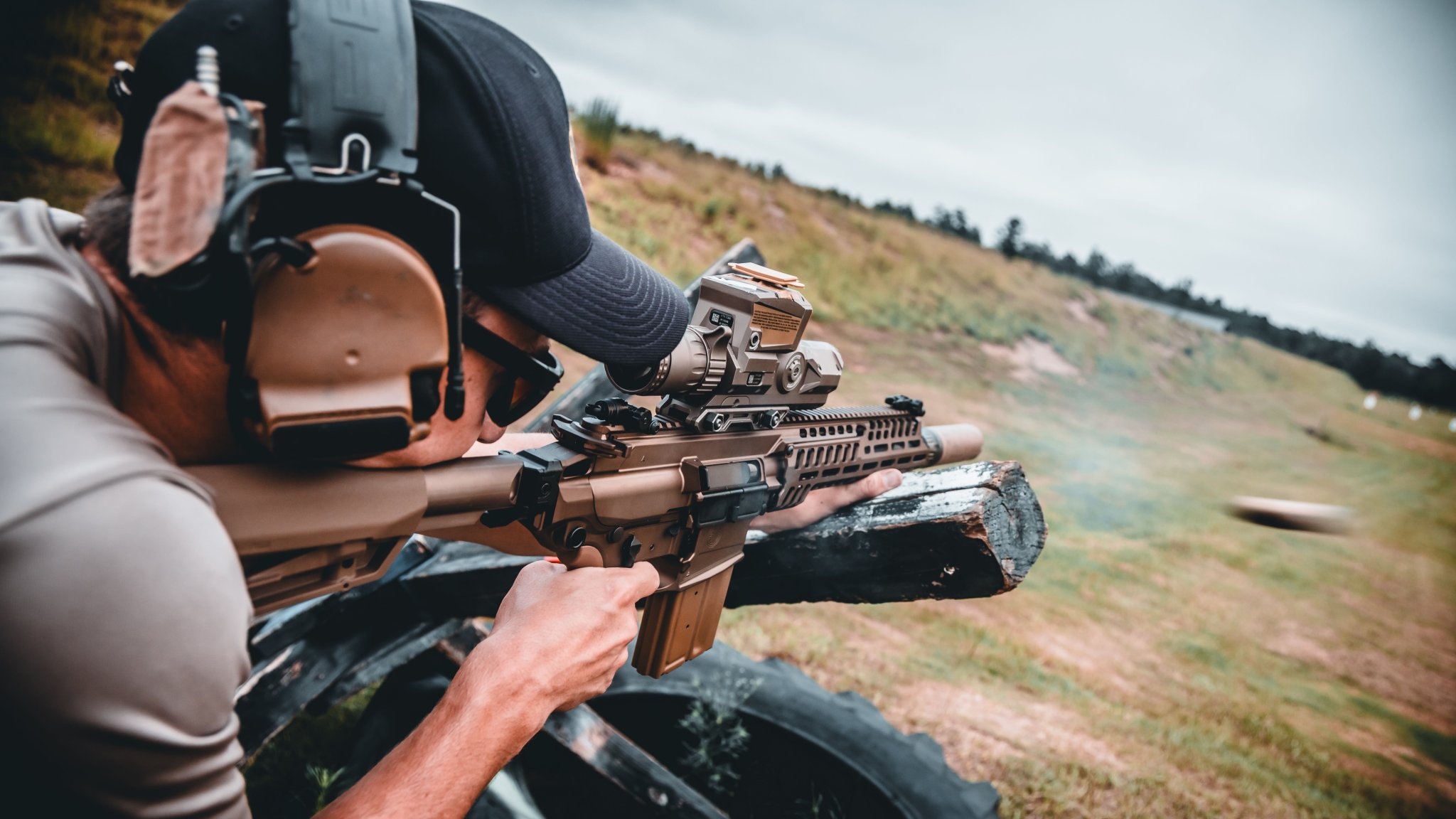 An instructor with the Marksmanship Master Trainer Course, fires his weapon during an M7 familiarization course at Fort Benning, Georgia, July 2, 2025. The U.S. Army Marksmanship Unit regularly partners with units across the Army to enhance lethality and precision through expert firearms instruction. (U.S. Army photo by Sgt. 1st Class Timothy Hamlin)