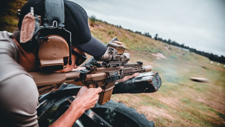 An instructor with the Marksmanship Master Trainer Course, fires his weapon during an M7 familiarization course at Fort Benning, Georgia, July 2, 2025. The U.S. Army Marksmanship Unit regularly partners with units across the Army to enhance lethality and precision through expert firearms instruction. (U.S. Army photo by Sgt. 1st Class Timothy Hamlin)