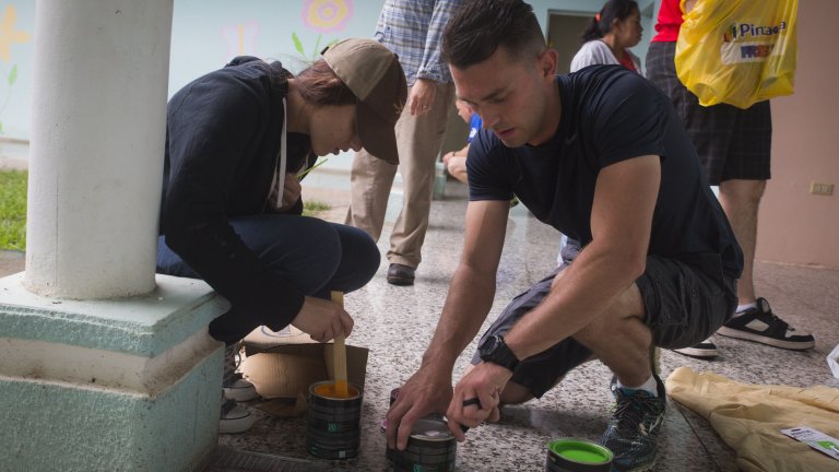 U.S. Marines Lance Cpl. Kaitlyn M. Erkson, an intelligence analyst with the Aviation Combat Element, Special Purpose Marine Air-Ground Task Force - Southern Command, and Sgt. Sean S. Saball, a data noncommissioned officer with the Command Element, SPMAGTF-SC, mix paint during a visit to Casa Misericordia orphanage for girls with disabilities in Comayagua, Honduras, Oct. 28, 2017. Service members with SPMAGTF-SC volunteered their time playing with the children, handing out toys and school supplies, and painting the orphanage. The Marines and sailors of SPMAGTF-SC have donated over 7,000 hours of community service to local communities throughout Central America during their six-month deployment. (U.S. Marine Corps photo by Sgt. Ian Leones)