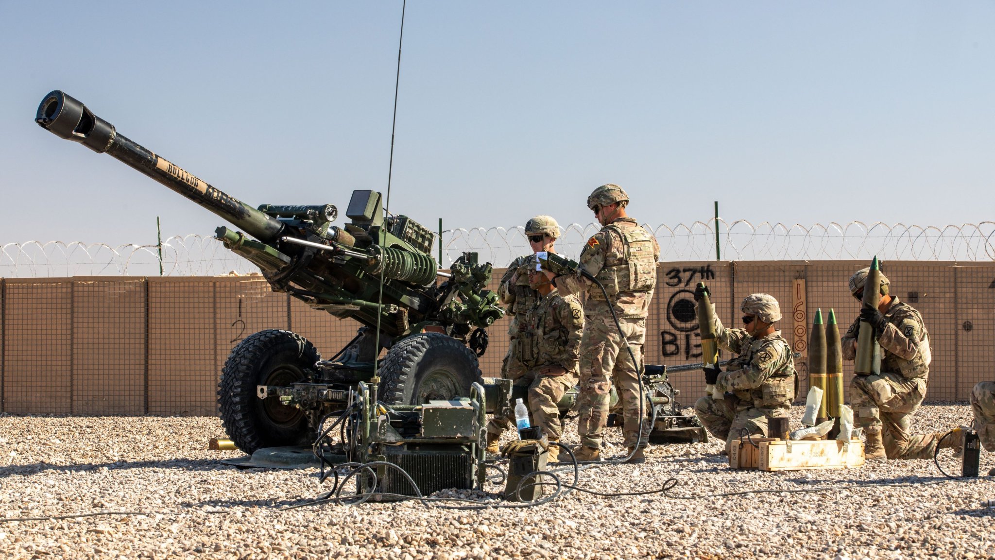 U.S. Soldiers with 2nd Platoon, Bravo Battery, 2-15 Field Artillery, 2nd Brigade Combat Team, 10th Mountain Division conduct an artillery live fire exercise at Al Asad Air Base, Iraq, Dec. 1, 2023. The live fire exercise was conducted to rehearse close support and precision-strike capabilities. (U.S. Army photo by Staff Sgt. Quince Lanford)