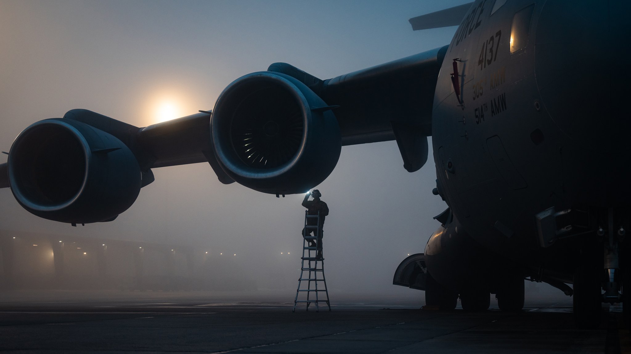 U.S. Air Force Senior Airman Hector Orenga, 305th Air Mobility Wing crew chief, conducts engine inspections on a C-17 Globemaster III at Joint Base McGuire-Dix-Lakehurst, N.J., Jan. 24, 2024. The C-17 is capable of rapid strategic delivery of troops and all types of cargo to main operating bases or directly to forward bases in deployed areas. (U.S. Air Force photo by Senior Airman Sergio Avalos)