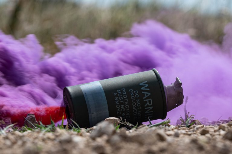 A smoke grenade is activated during exercise Jolly Vihar 24 near Pápa Air Base, Hungary, July 23, 2024. The 56th and 57th Rescue Squadrons participated in exercise Jolly Vihar 24 with their Hungarian partners to practice combat search and rescue in integrated operations. (U.S. Air Force photo by Airman 1st Class Joseph Bartoszek)