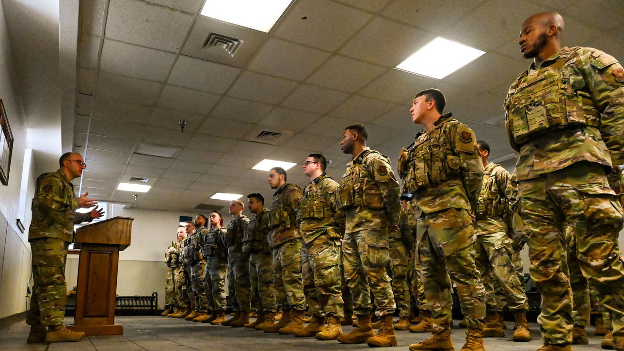 Lt. Col. Tyler Hiatt (left), 90th Missile Security Forces Squadron commander, briefs 90 MSFS Alpha Flight during guard mount before they trip out to the missile field at F.E. Warren Air Force Base, Wyoming, Feb. 13, 2025. 90, 790, and 890 MSFS rotate tripping out to the missile field monthly to reside in a missile alert facility for a week, ensuring the constant security and protection of the Minuteman III - one of the nation’s most powerful strategic assets. Their 24/7/365 vigilance guarantees the Minuteman III weapon system remains secure, operational, and ready at a moment’s notice to uphold the U.S. nuclear deterrence mission. (U.S. Air Force photo by Airman 1st Class Mattison Cole)