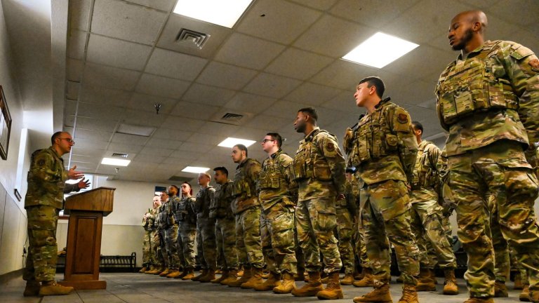 Lt. Col. Tyler Hiatt (left), 90th Missile Security Forces Squadron commander, briefs 90 MSFS Alpha Flight during guard mount before they trip out to the missile field at F.E. Warren Air Force Base, Wyoming, Feb. 13, 2025. 90, 790, and 890 MSFS rotate tripping out to the missile field monthly to reside in a missile alert facility for a week, ensuring the constant security and protection of the Minuteman III - one of the nation’s most powerful strategic assets. Their 24/7/365 vigilance guarantees the Minuteman III weapon system remains secure, operational, and ready at a moment’s notice to uphold the U.S. nuclear deterrence mission. (U.S. Air Force photo by Airman 1st Class Mattison Cole)