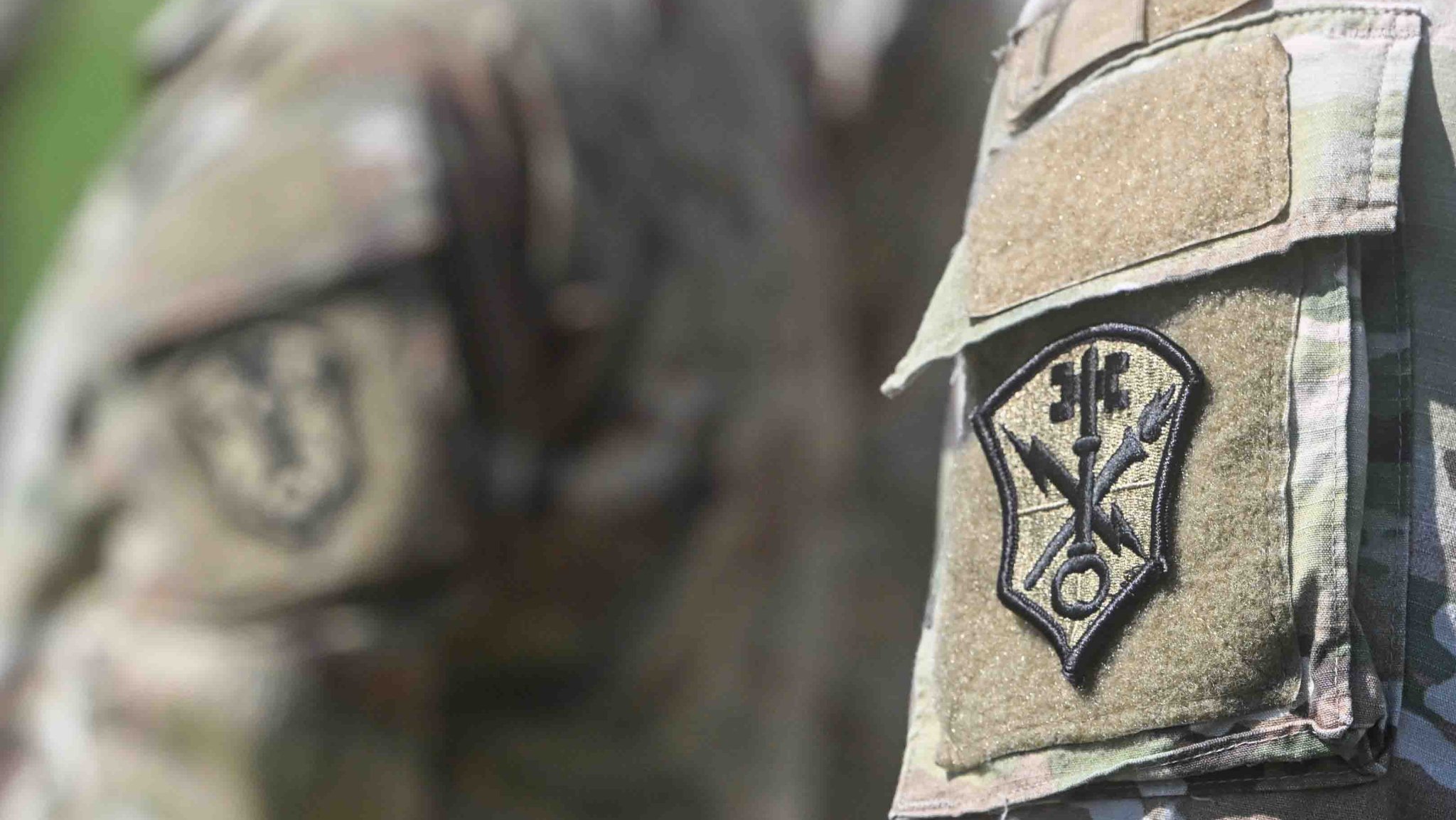 Soldiers gather during a promotion and reenlistment ceremony outside Army Counterintelligence Command headquarters, July 14, 2025, Fort George G. Meade, Maryland.