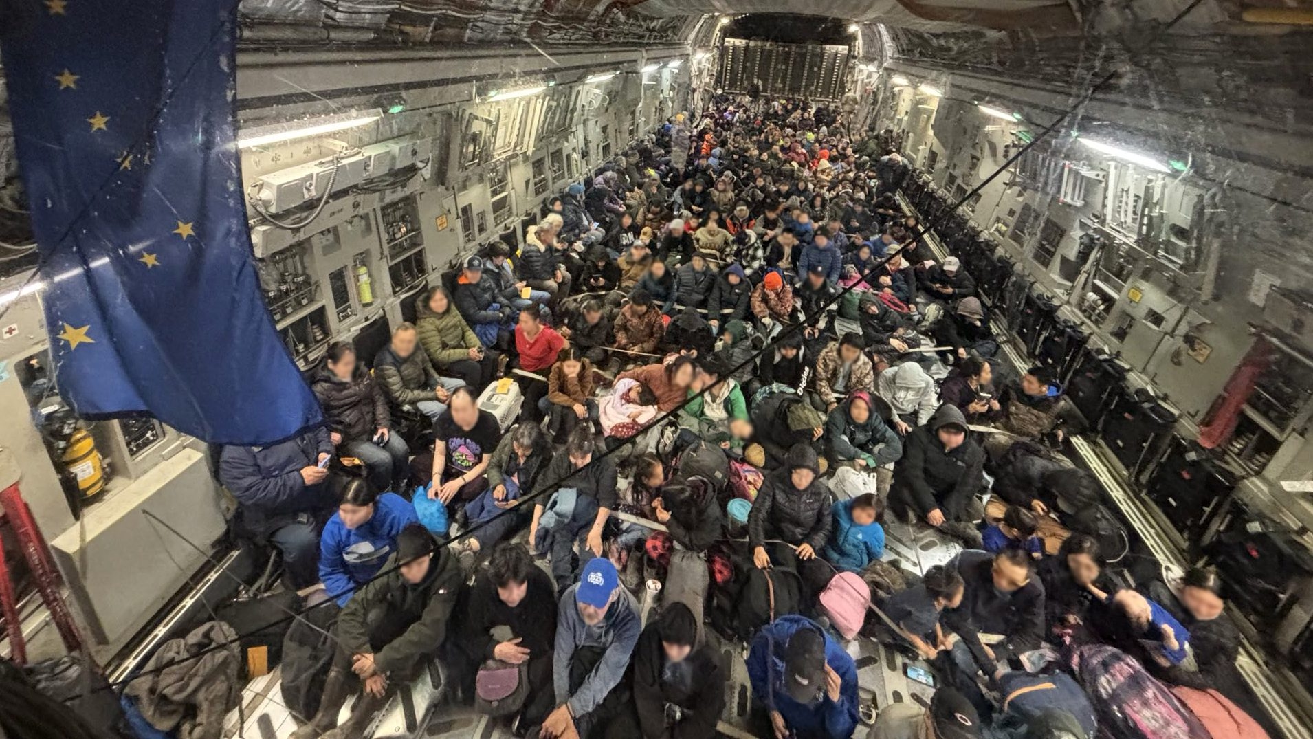 Alaska Air National Guard C-17 Globemaster III aircrew, assigned to the 176th Wing, evacuate approximately 300 displaced western Alaska residents from Bethel, Alaska, following Typhoon Halong, Oct. 15, 2025. The State Emergency Operations Center and the Alaska Organized Militia continue to coordinate response operations following the severe storm that struck Alaska’s West Coast. (Alaska National Guard photo by Staff Sgt. Joseph Moon) This photo was altered for privacy purposes by blurring out faces.