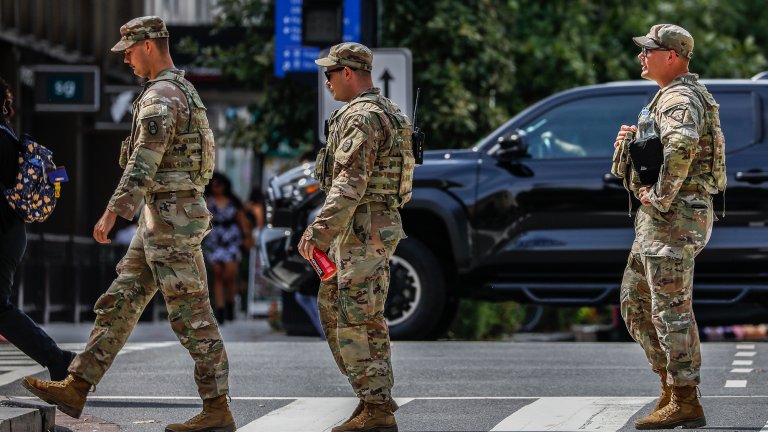 WASHINGTON D.C., USA - SEPTEMBER 15: National Guard troops patrol around the Farragut west metro station as part of heightened security measures in Washington, D.C., United States, on September 15, 2025. (Photo by Yasin Ozturk/Anadolu via Getty Images)