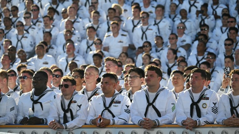 US Navy sailors listen to US President Donald Trump speak as he visits the USS Harry S. Truman during the US Navy's 250th anniversary celebration, "America's Navy 250: Titans of the Sea - A Salute to the Fleet", at Naval Station Norfolk Pier 14 in Norfolk, Virginia on October 5, 2025. (Photo by SAUL LOEB / AFP) (Photo by SAUL LOEB/AFP via Getty Images)