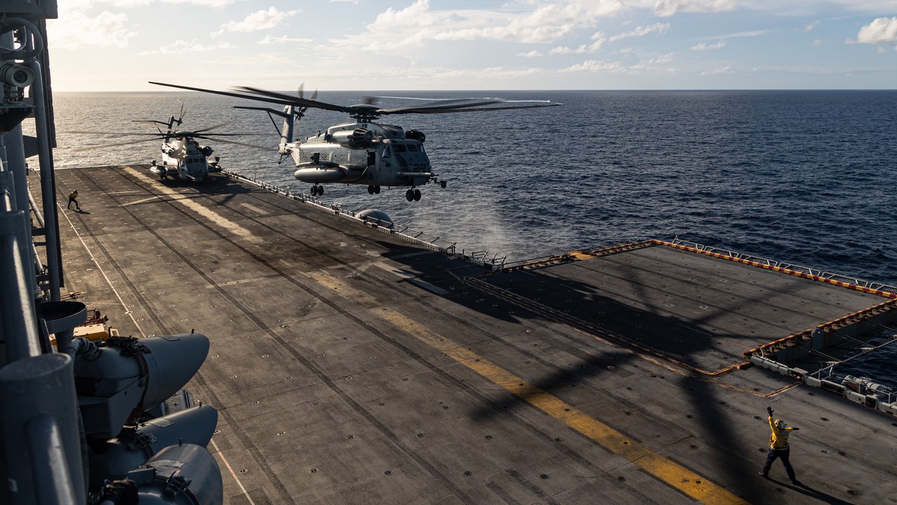 CARIBBEAN SEA – U.S. Marine Corps CH-53E Super Stallion helicopters with Marine Medium Tiltrotor Squadron (VMM) 263 (Reinforced), 22nd Marine Expeditionary Unit (Special Operations Capable), takes off during flight operations aboard the Wasp-class amphibious assault ship USS Iwo Jima (LHD 7), while underway in the Caribbean Sea, Sept. 23, 2025. U.S. military forces are deployed to the Caribbean in support of the U.S. Southern Command mission, Department of War-directed operations, and the president’s priorities. (U.S. Marine Corps photo by Cpl. Emily Hazelbaker)