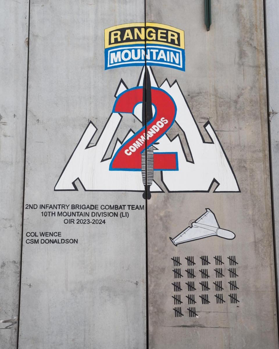 A painting on a concrete barrier, or T-wall, in Erbil includes a tally of the 110 drone 'kills' that 10th Mountain Division soldiers scored during the deployment.