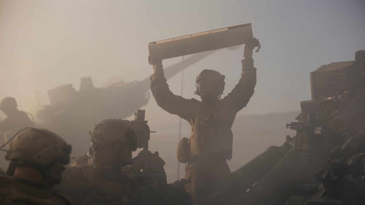 U.S. Marines with 2nd Battalion, 11th Marine Regiment, 1st Marine Division, reload an M777 lightweight 155mm howitzer during a rehearsal for the 250th Amphibious Capabilities Demonstration at Red Beach combat town, Marine Corps Base Camp Pendleton, Oct. 17, 2025. The 250th Amphibious Capabilities Demonstration at Camp Pendleton marks the Marine Corps’ 250th birthday and America’s Semiquincentennial. The live-fire event highlights the Navy-Marine Corps team’s ability to integrate across air, land, and sea, showcasing the Corps’ enduring role as America’s force in-readiness. (U.S. Marine Corps photo by Gunnery Sgt. Aaron S. Patterson)