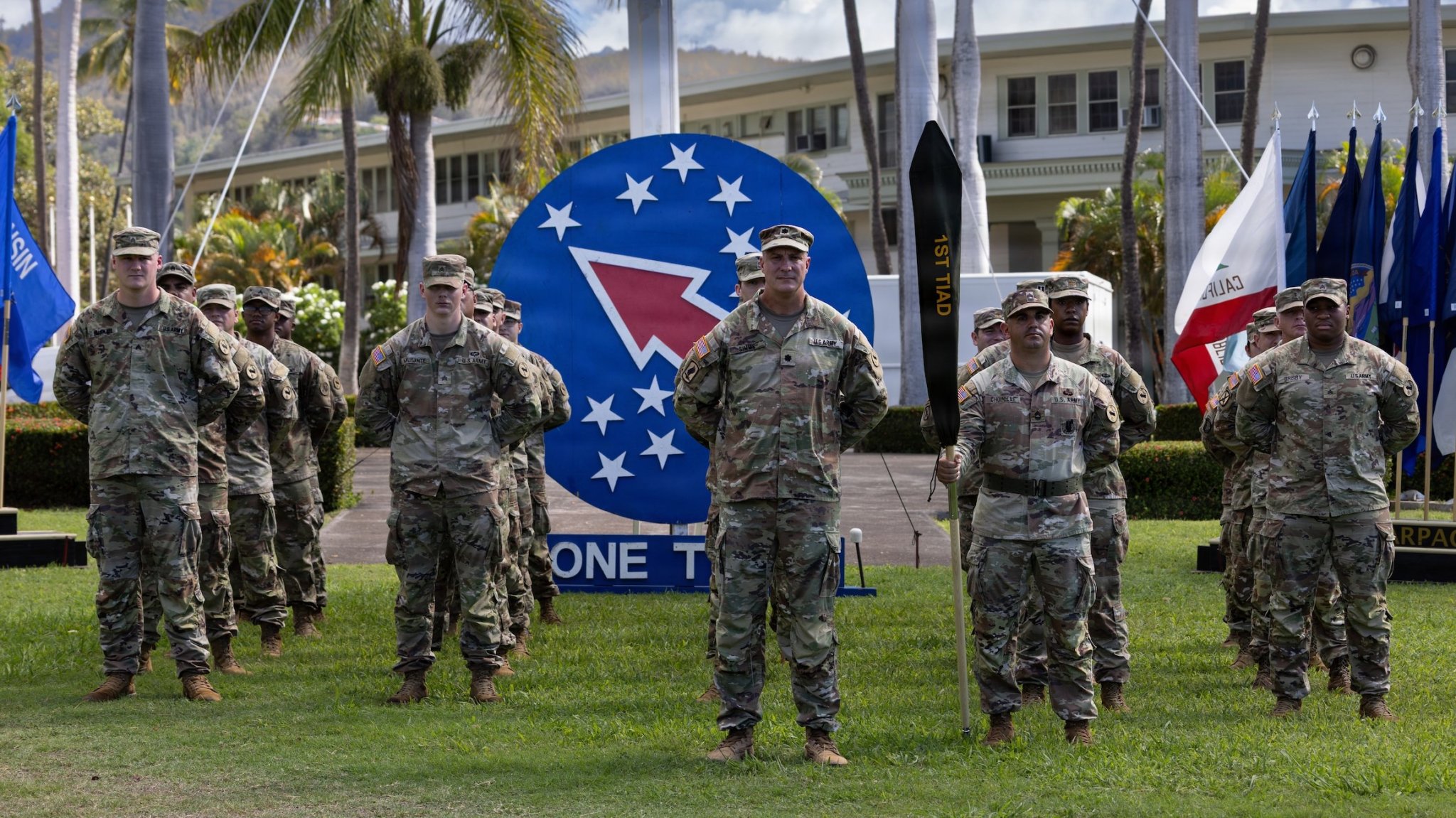 Lt. Col. Joshua Simms, executive officer for the 1st Theater Information Advantage Detachment, stands before the unit at the beginning of the activation ceremony November 7, 2025, at Fort Shafter, Hawaii. The activation ceremony of 1st Theater Information Advantage Detachment marks a strategic shift in the Army’s ability to gain and maintain information advantage to support a free and open Indo-Pacific. (U.S. Army Photo by Russell K. Dodson)