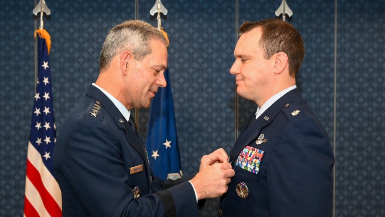 Air Force Chief of Staff Gen. Ken Wilsbach presents the Silver Star Medal to Lt. Col. William Parks during a ceremony at the Pentagon, Arlington, Va., Nov. 26, 2025. Parks also received the Bronze Star Medal during the ceremony. (U.S. Air Force photo by Staff Sgt. Stuart Bright)