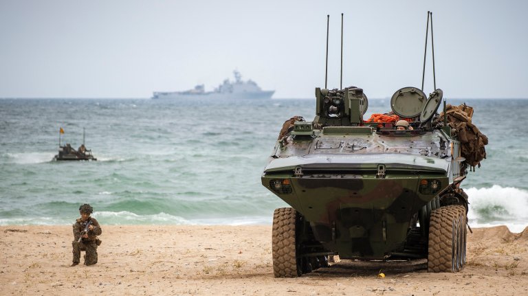 A U.S. Marine Corps Amphibious Combat Vehicle and Marines assigned to Alpha Company, Battalion Landing Team 1/5, 15th Marine Expeditionary Unit, secure a beach during a simulated amphibious assault at Hwajin-ri, South Korea, Sept. 2, 2024, as part of exercise Ssang Yong 24. Exercise SY24 strengthens the Republic of Korea-U.S. Alliance through bilateral, joint training, contributing toward combined amphibious capability in defense of the Korean Peninsula. (U.S. Marine Corps photo by Cpl. Amelia Kang)