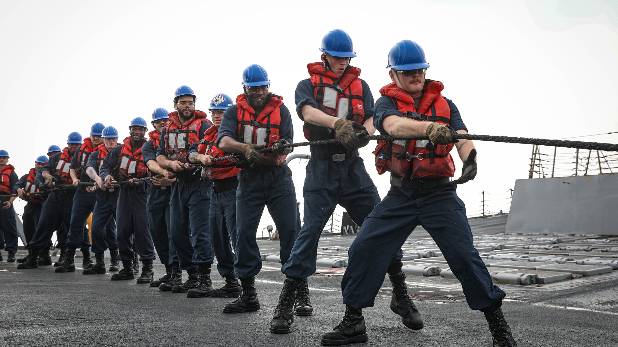 U.S. CENTRAL COMMAND AREA OF RESPONSIBILITY (April 10, 2025) U.S. Sailors handle line aboard the Arleigh Burke-class guided-missile destroyer USS Jason Dunham (DDG 109) during a replenishment-at-sea with the fast combat support ship USNS Arctic (TAO-E 8) in the U.S. Central Command area of responsibility. (Official U.S. Navy photo)