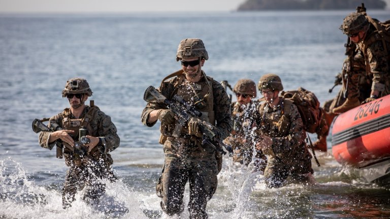 U.S. Marine Corps assigned to Lima Company, 3rd Battalion, 25th Marines Regiment, disembark from a 26-foot over-the-horizon cutter boat, piloted by crew assigned to USCGC Robert Yered (WPC 114), to conduct an amphibious assault during the multi-domain, combined full mission profile of TRADEWINDS 25 (TW25) at Chaguaramas, Trinidad and Tobago, May 7, 2025. TW25 is a U.S. Southern Command-sponsored and Chairman of the Joint Chiefs of Staff-approved annual exercise that bolsters regional stability and demonstrates U.S. Joint Force coordination and interoperability with Allies and partners. (U.S. Army photo by Sgt. John Russell)