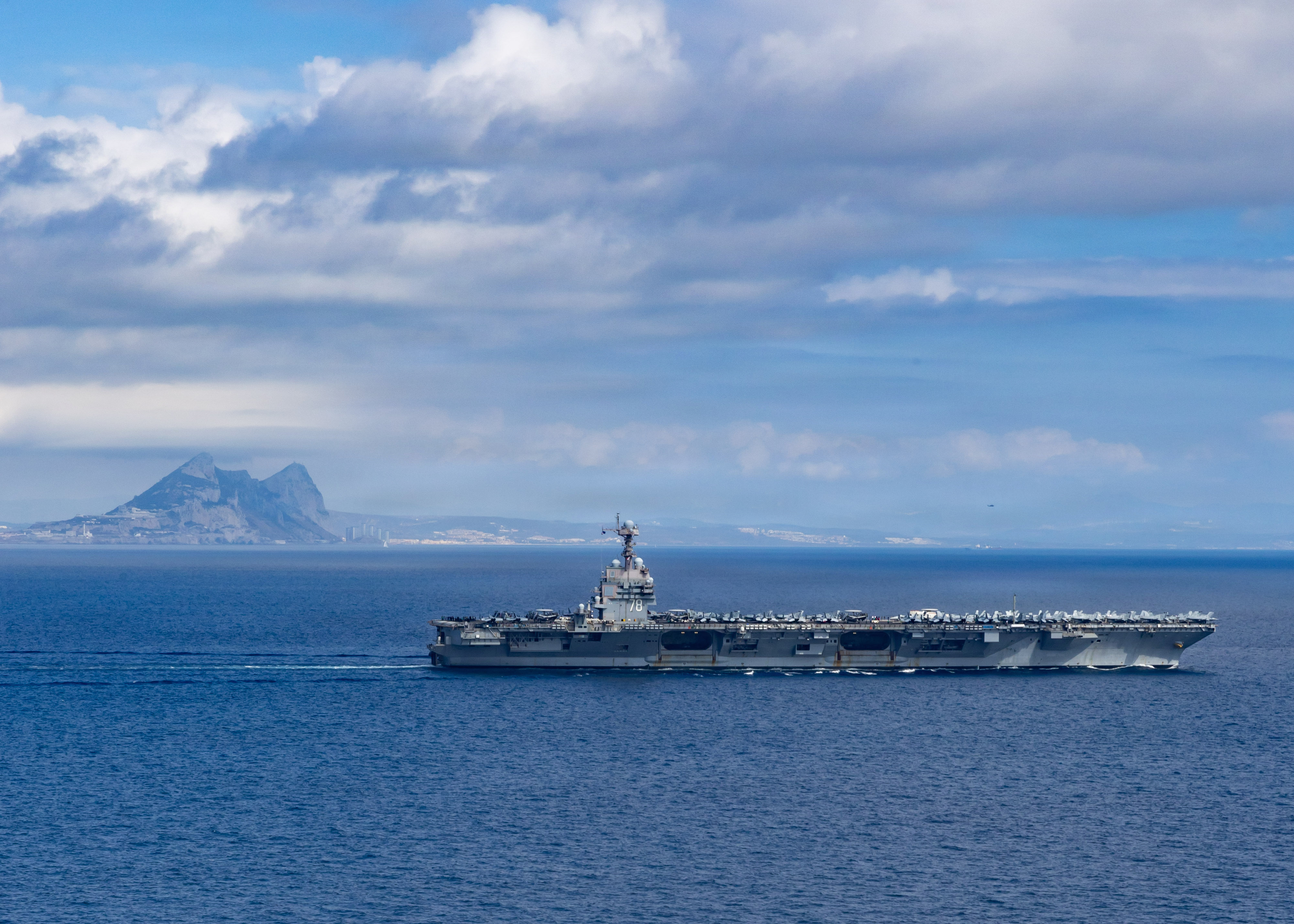 The world’s largest aircraft carrier, USS Gerald R. Ford (CVN 78), transits the Strait of Gibraltar, Oct. 1, 2025. Gerald R. Ford, a first-in-class aircraft carrier and deployed flagship of Carrier Strike Group Twelve, is on a scheduled deployment in the U.S. 6th Fleet area of operations to support the warfighting effectiveness, lethality and readiness of U.S. Naval Forces Europe-Africa, and defend U.S., Allied and partner interests in the region. (U.S. Navy photo by Mass Communication Specialist Seaman Apprentice Alyssa Joy)