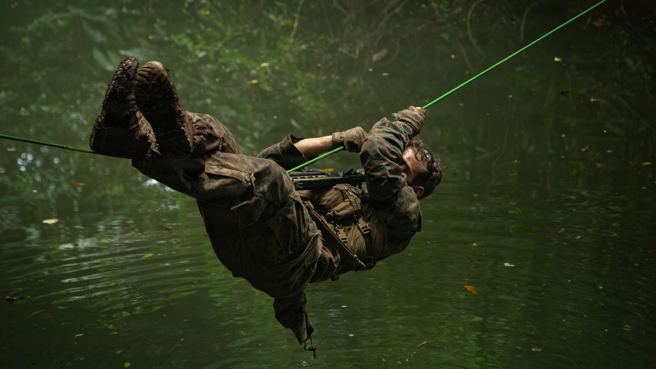 U.S. Marine Corps Cpl. Mason Weasel, a member 2nd Battalion, 6th Marines, crosses a rope bridge at Base Aeronaval Cristóbal Colón, Panamá, Oct. 27, 2025. U.S. Southern Command is focused on increasing partner nation capacity and interoperability in the region and reflects the United States’ enduring promise of friendship, partnership, and solidarity with the Panamanian people. (U.S. Army photo by Spc. Trey Woodard)