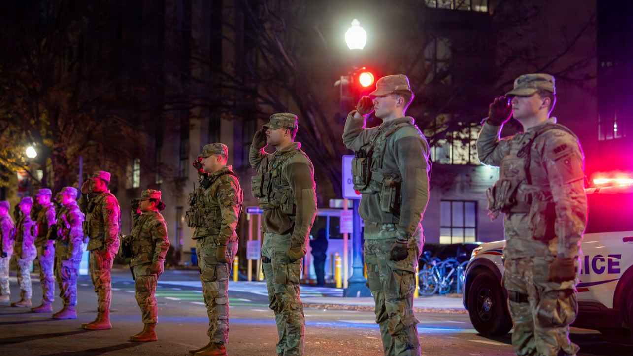 U.S. service members line the streets of Washington, D.C., during an honor escort—also known as a fallen soldier procession—for U.S. Army Spc. Sarah Beckstrom of the West Virginia National Guard, Nov. 27, 2025. A fallen soldier procession is a solemn tradition in which military members stand in silent respect as a fallen service member is escorted to their final resting place, symbolizing the nation’s gratitude for a life given in service. (U.S. Air National Guard photo by Master Sgt. William Blankenship)