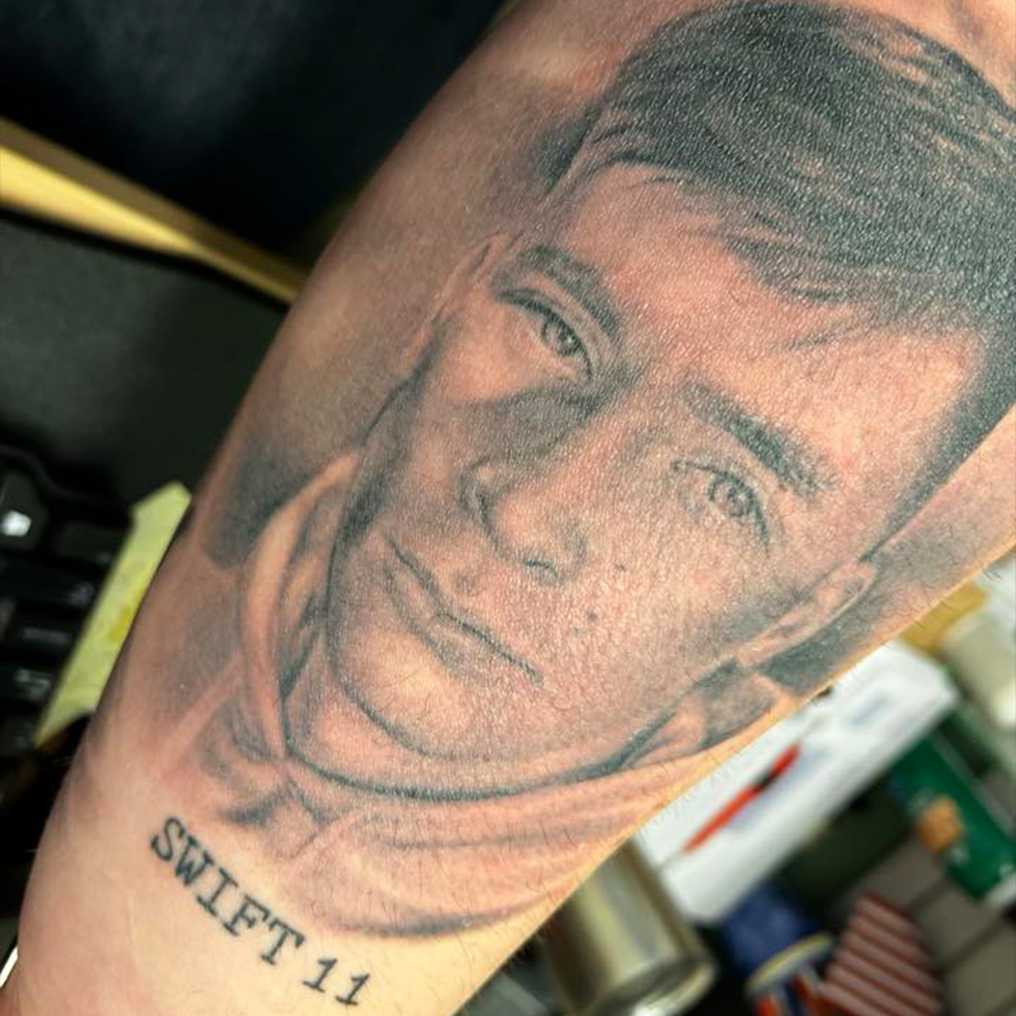 Brett Strickland's tattoo of his son, Ethan, is on his arm, with the callsign of the Marine MV-22 he was flying on when it crashed in 2022.