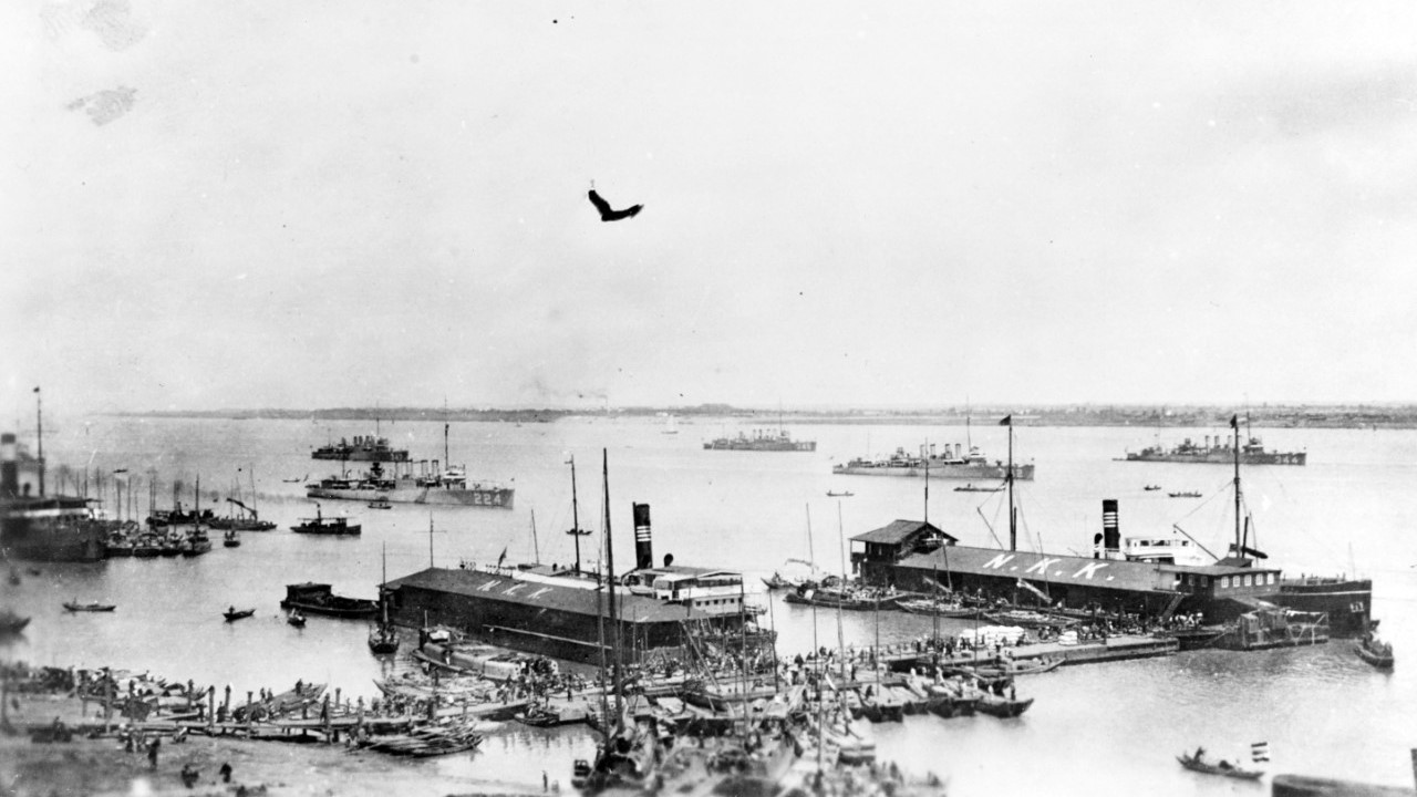 Description: circa April-May 1923 The destroyers are, from left to right: USS Pruitt (DD-347) USS Stewart (DD-224) USS Preble (DD-345) USS Hulbert (DD-342) and USS William B. Preston (DD-344). The Japan-China Steamship Company (N.K.K. Nisshin Kisen Kaisha) docks are in the foreground, with a river steamer alongside in the center and an ocean-going freighter at right. Many local small craft are also present. Courtesy of Donald M. McPherson, 1969. U.S. Naval History and Heritage Command Photograph.