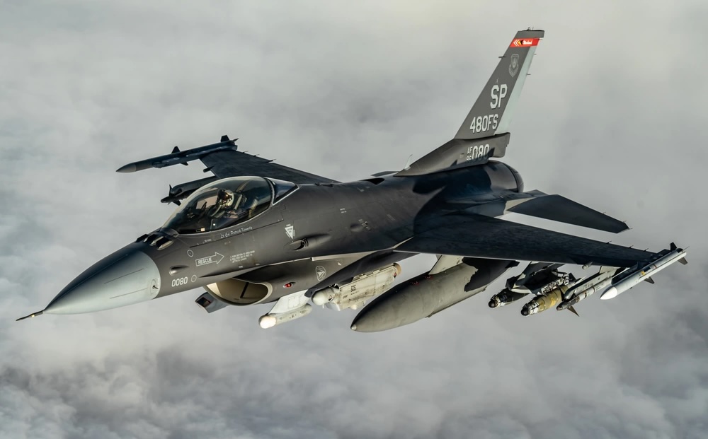 A U.S. Air Force F-16 with a Have Glass paint scheme after receiving fuel from a KC-135 Stratotanker, assigned to the 50th Expeditionary Aircraft Refueling Squadron, during an air refueling mission over Southwest Asia, Dec. 22, 2020. Air Force photo by Staff Sgt. Trevor McBride.