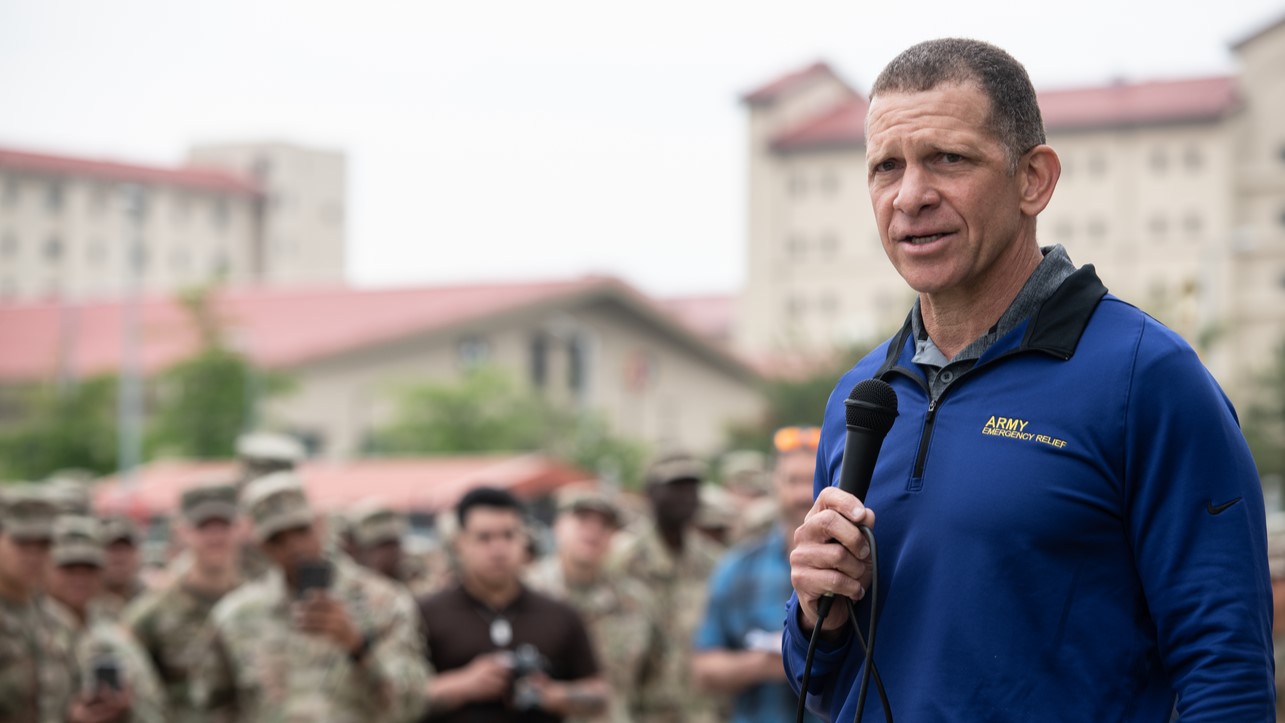 Retired Sgt. Maj. of the Army Tony Grinston, currently the CEO of Army Emergency Relief, talks to troops in South Korea.