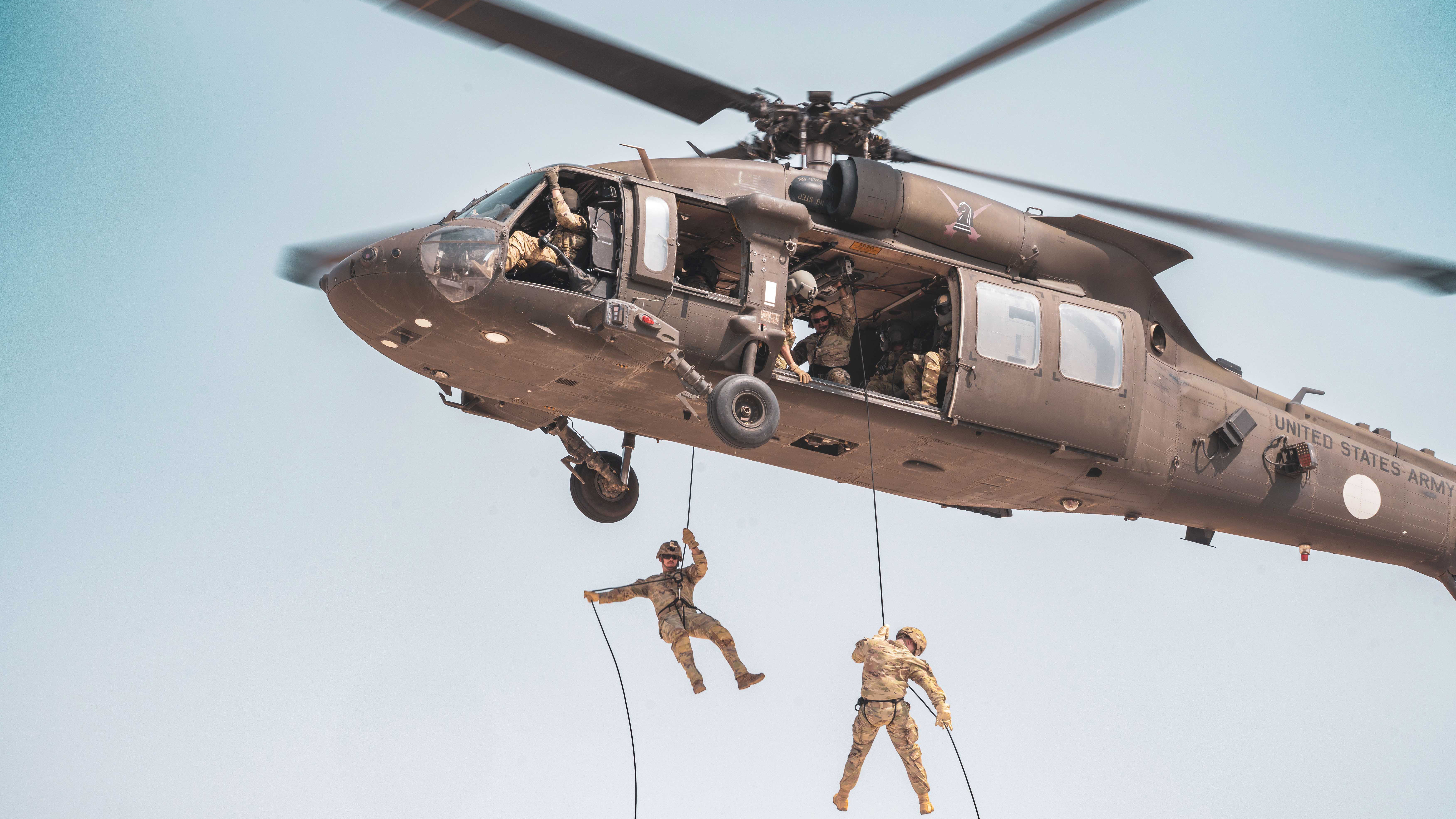 U.S. Army Soldiers conduct Fast Rope Insertion/Extraction System (FRIES) training with a UH-60M Black Hawk helicopters at Camp Buehring, Kuwait, Aug. 28, 2025. Cadre from The Sabalauski Air Assault School led the training in partnership with aviators from 5th Battalion, 101st Aviation Regiment, 101st Combat Aviation Brigade. The exercise allowed Soldiers and Aircrews to practice the precise maneuvers and actions that enable this insertion technique to be employed in austere, combat environments. (U.S. Army photos by Staff Sgt. Brad Stepien)