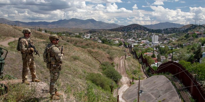 U.S. Army Sgt. 1st Class Christopher Warner, left, and U.S. Army 2nd Lt. Christian Eichelberger, both with 2nd Battalion, 12th Infantry Regiment, 2nd Stryker Brigade Combat Team, 4th Infantry Division, assigned to Joint Task Force-Southern Border (JTF-SB), monitor the southern border near Nogales, Ariz., Sept. 17, 2025. JTF-SB executes full-scale, agile, and all-domain operations in support of U.S. Customs and Border Protection to protect the territorial integrity of the United States and achieve 100% operational control of the southern border. (U.S. Army photo by Pfc. Sean Hoch)