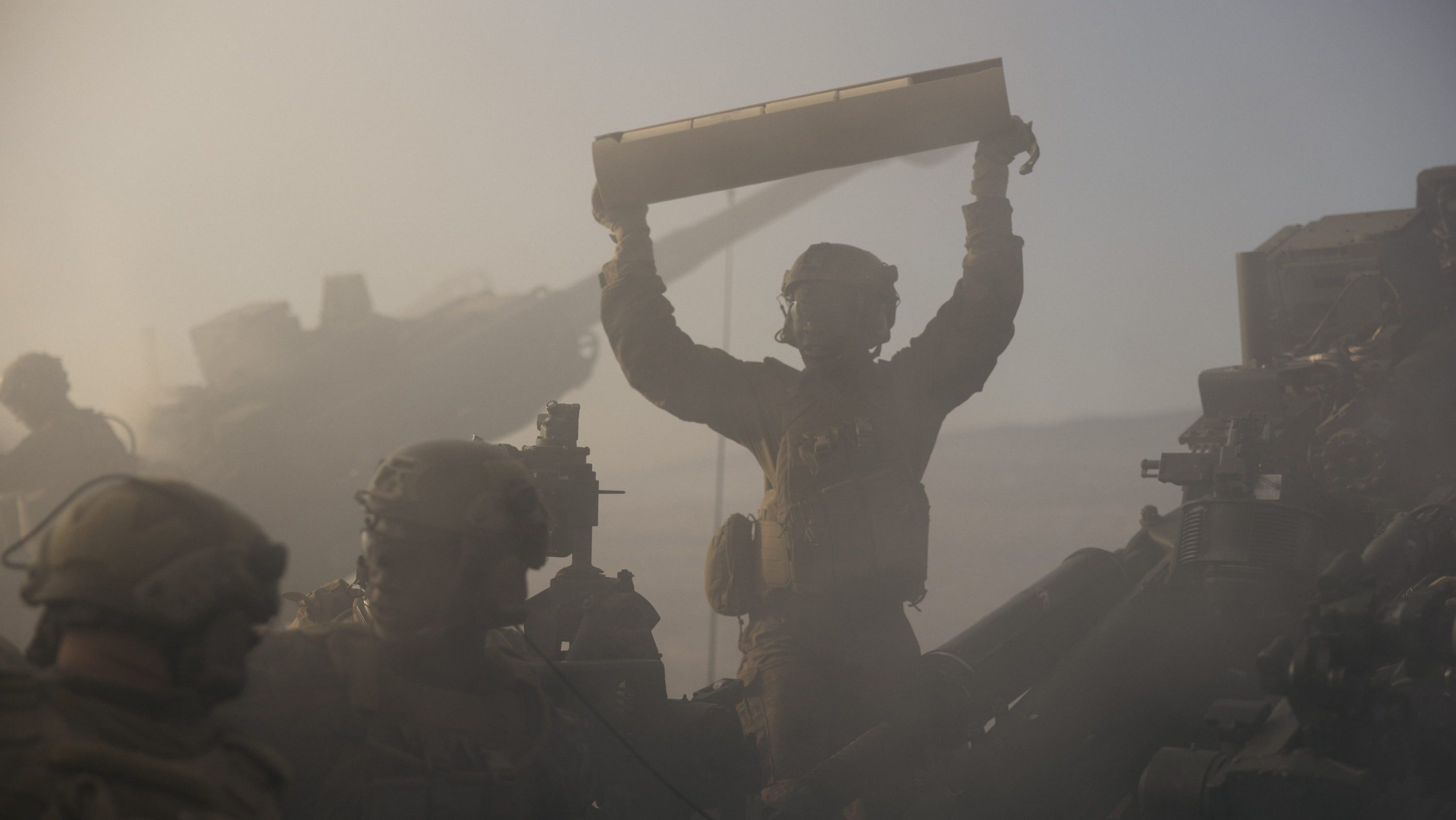 U.S. Marines with 2nd Battalion, 11th Marine Regiment, 1st Marine Division, reload an M777 lightweight 155mm howitzer during a rehearsal for the 250th Amphibious Capabilities Demonstration at Red Beach combat town, Marine Corps Base Camp Pendleton, Oct. 17, 2025. The 250th Amphibious Capabilities Demonstration at Camp Pendleton marks the Marine Corps’ 250th birthday and America’s Semiquincentennial. The live-fire event highlights the Navy-Marine Corps team’s ability to integrate across air, land, and sea, showcasing the Corps’ enduring role as America’s force in-readiness. (U.S. Marine Corps photo by Gunnery Sgt. Aaron S. Patterson)