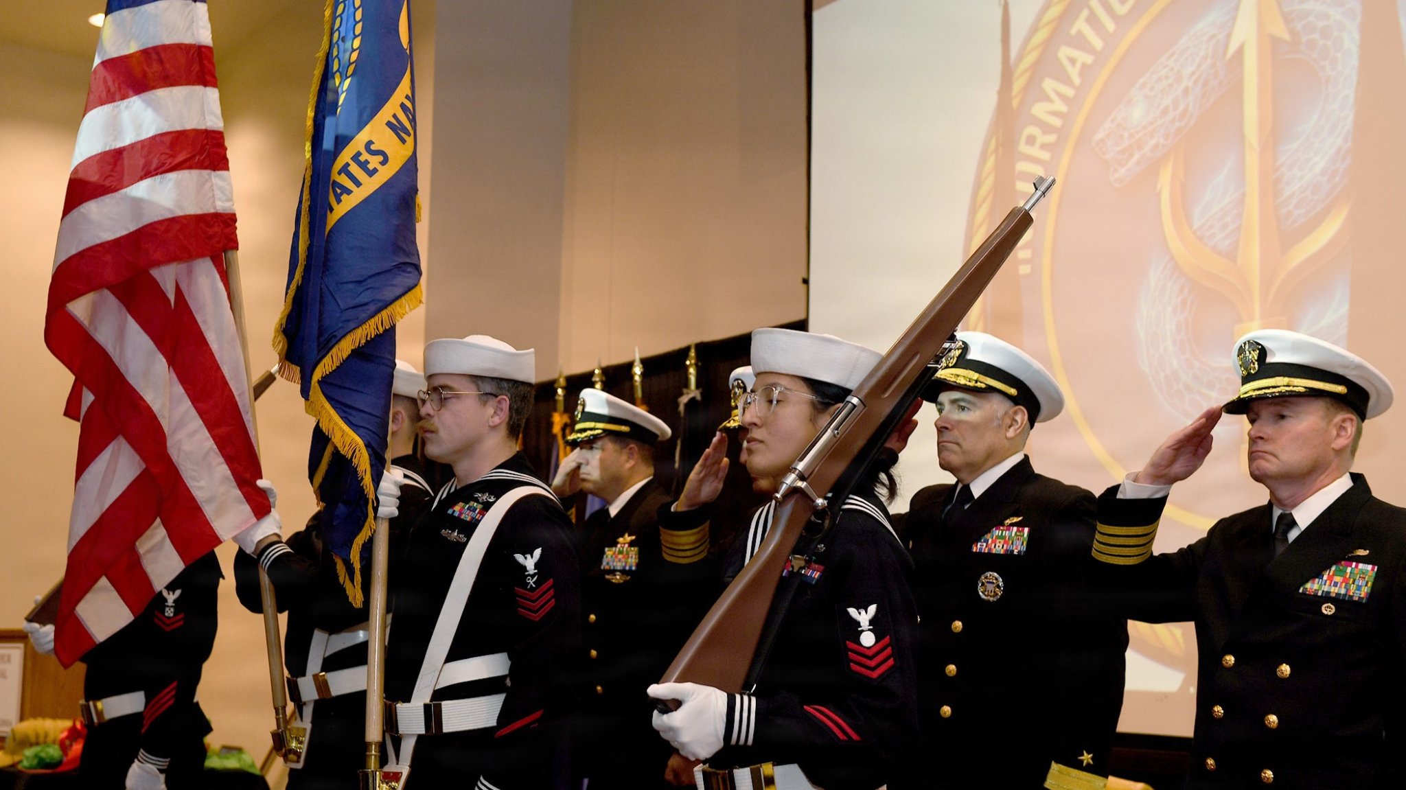 Image Capt. Jon O’Connor, prospective Commanding Officer, Information Warfare Squadron (IWRON) Two, and Rear Adm. Dusty Rhodes, Commander, Carrier Strike Group TWO, render a salute during an assumption of command ceremony for IWRON Two in Norfolk, Virginia. IWRON Two, a first-of-its-kind unit designed to operationalize Information Warfare (IW) capabilities and provide decisive decision advantage to Carrier Strike Group Commanders, was established, Dec. 5. IWRON Two will serve as the pilot squadron on the East Coast, with another squadron being established on the West Coast in 2026 The establishment of IWRON Two marks a crucial step forward in ensuring the U.S. Navy remains the premier warfighting force – ready, capable, and unmatched. (U.S. Navy photo by MC2 Ray McCann / RELEASED)