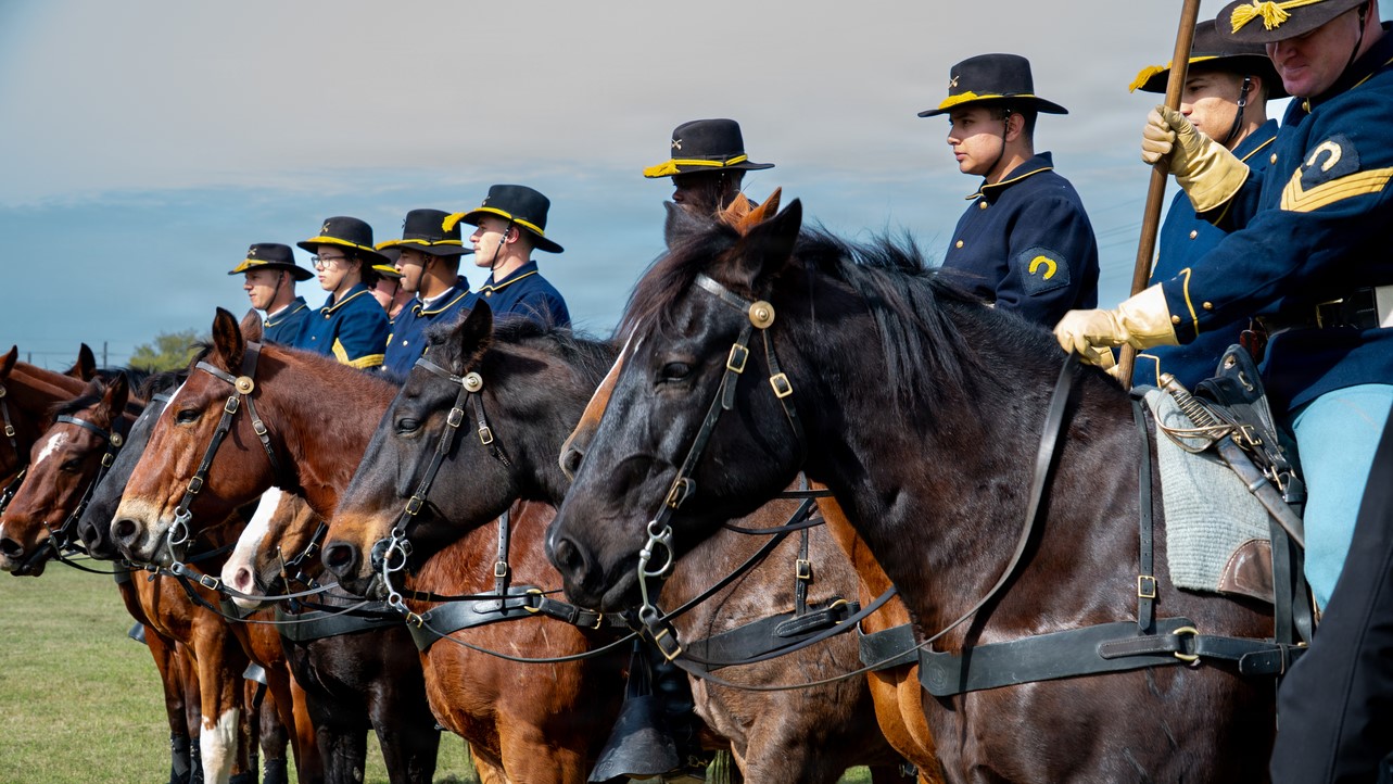 Image: The 1st Cavalry Division, Horse Cavalry Detachment poses for photos during a retirement ceremony for 1st Sgt. Brandon P. Mims, on Fort Hood, Texas, Dec. 05, 2025. The ceremony included a presentation of multiple awards, the Color Guard, a cavalry charge, and the attendance of family and friends. (U.S. Army photo by Pfc. Michelle Lessard-Terry)