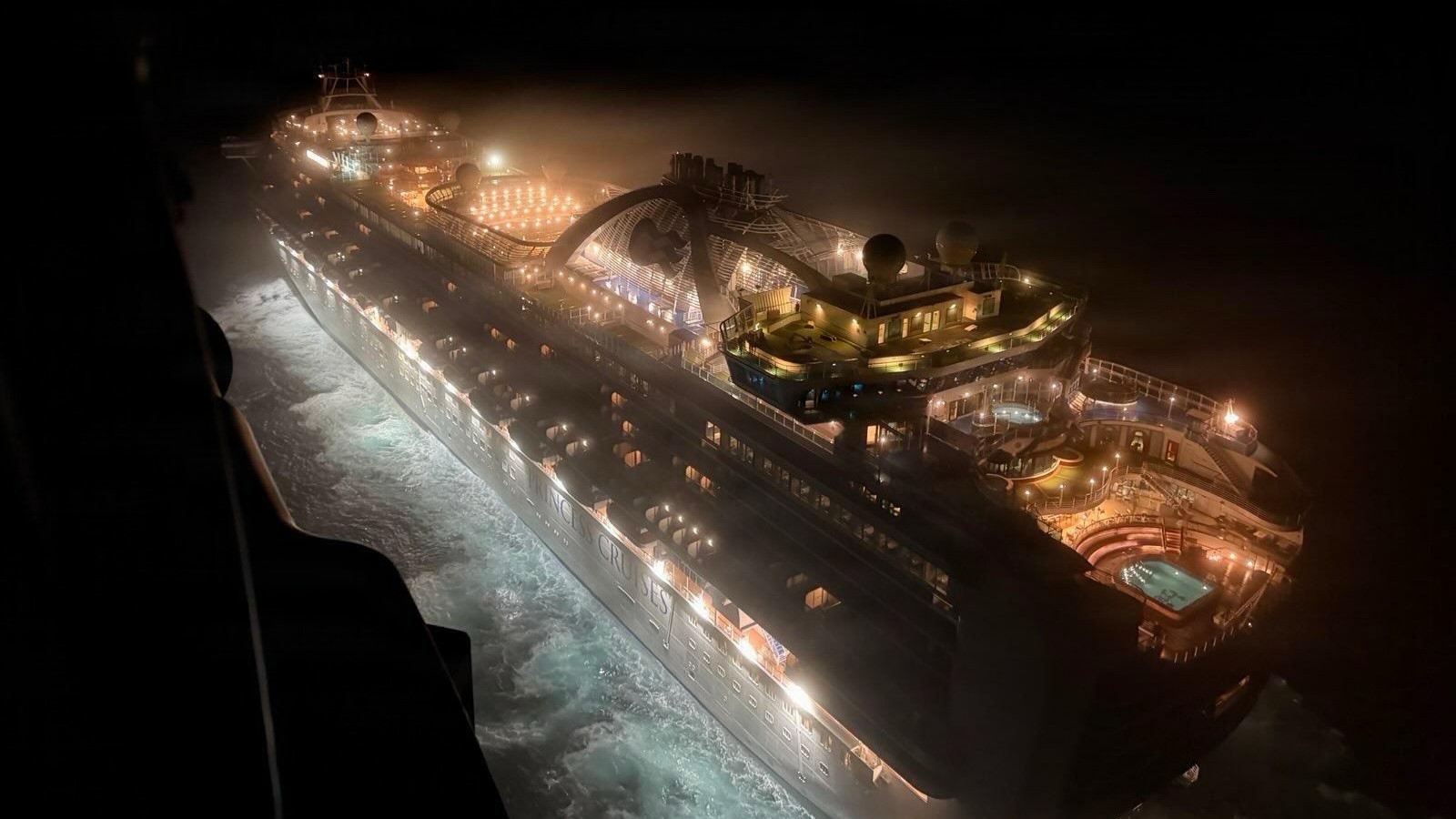 A helicopter from the 129th Rescue Wing, California Air National Guard, approaches the Ruby Princess cruise ship early Wednesday morning, Dec. 17, on a moonless night 130 nautical miles southwest of San Francisco. A cruise passenger experienced a life-threatening medical emergency requiring expeditious transfer to a hospital in San Jose, California. (Courtesy photo)