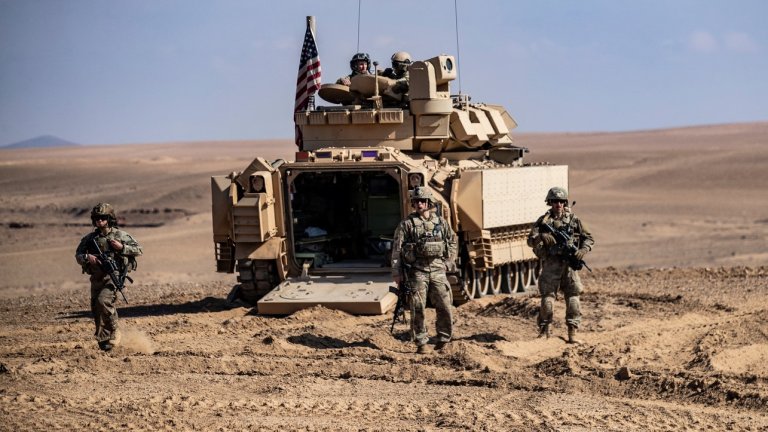 Troops from the Syrian Democratic Forces (SDF) Special Operations and the US-led anti-jihadist coalition, take part in heavy-weaponry military exercises in the countryside of Deir Ezzor in northeastern Syria, on March 25, 2022. (Photo by Delil SOULEIMAN / AFP) (Photo by DELIL SOULEIMAN/AFP via Getty Images)