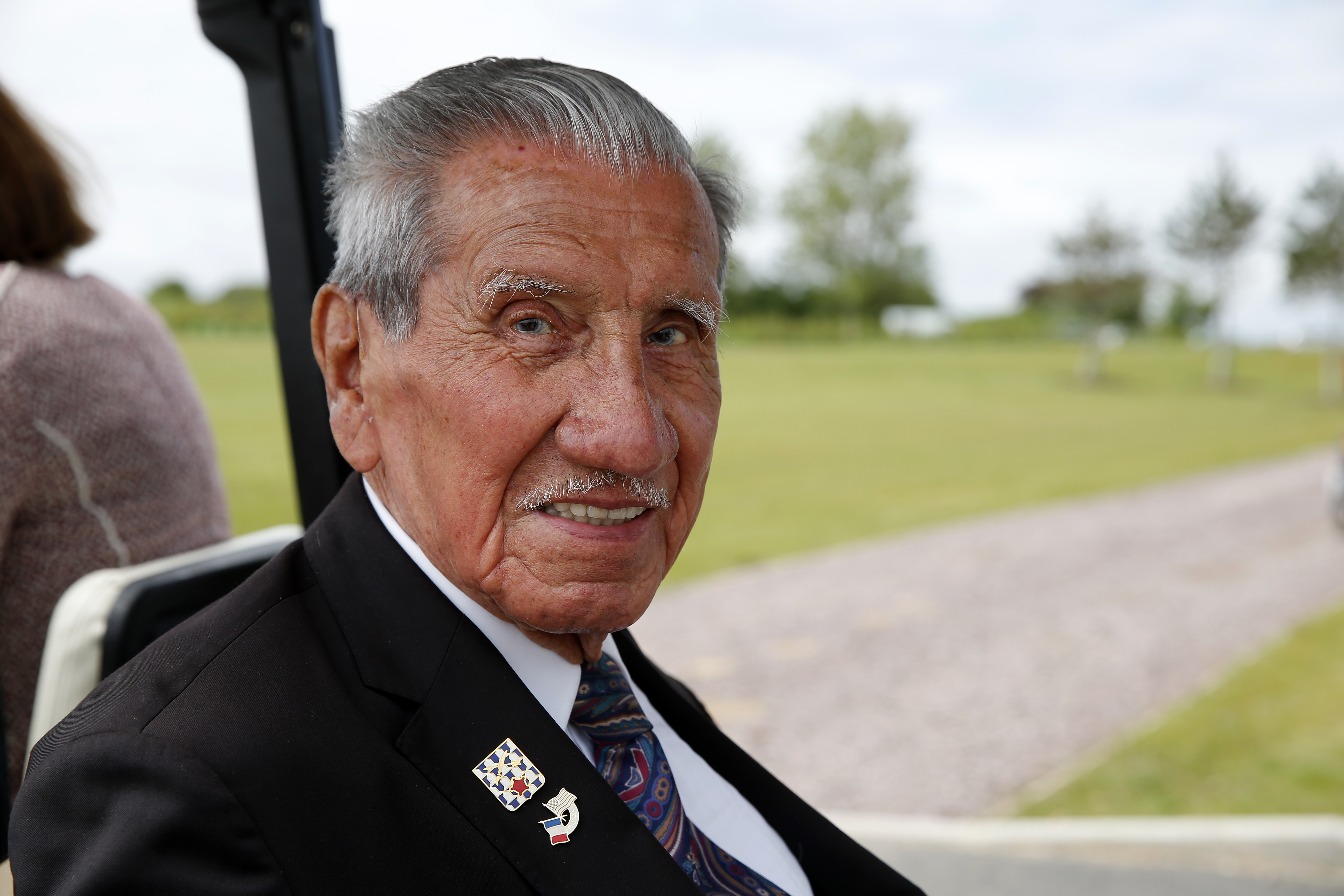 VER-SUR-MER, FRANCE - JUNE 06: US Veteran Charles Norman Shay, 96 poses after the official opening ceremony of the British Normandy Memorial on the 77th anniversary of D-Day on June 06, 2021 in Ver-sur-Mer, Normandy, France. On June 6, 2019, the (now former) Prime Minister of Great Britain, Theresa May, and Emmanuel Macron, President of the French Republic, laid the first stone of a Memorial dedicated to the 22,442 victims who fell under British command during the Battle of Normandy. With extensive travel restrictions in place due to the COVID-19 pandemic, commemorations of the pivotal WWII operation are smaller affairs this year, with most veterans marking the occasion closer to home. (Photo by Thierry Chesnot/Getty Images)