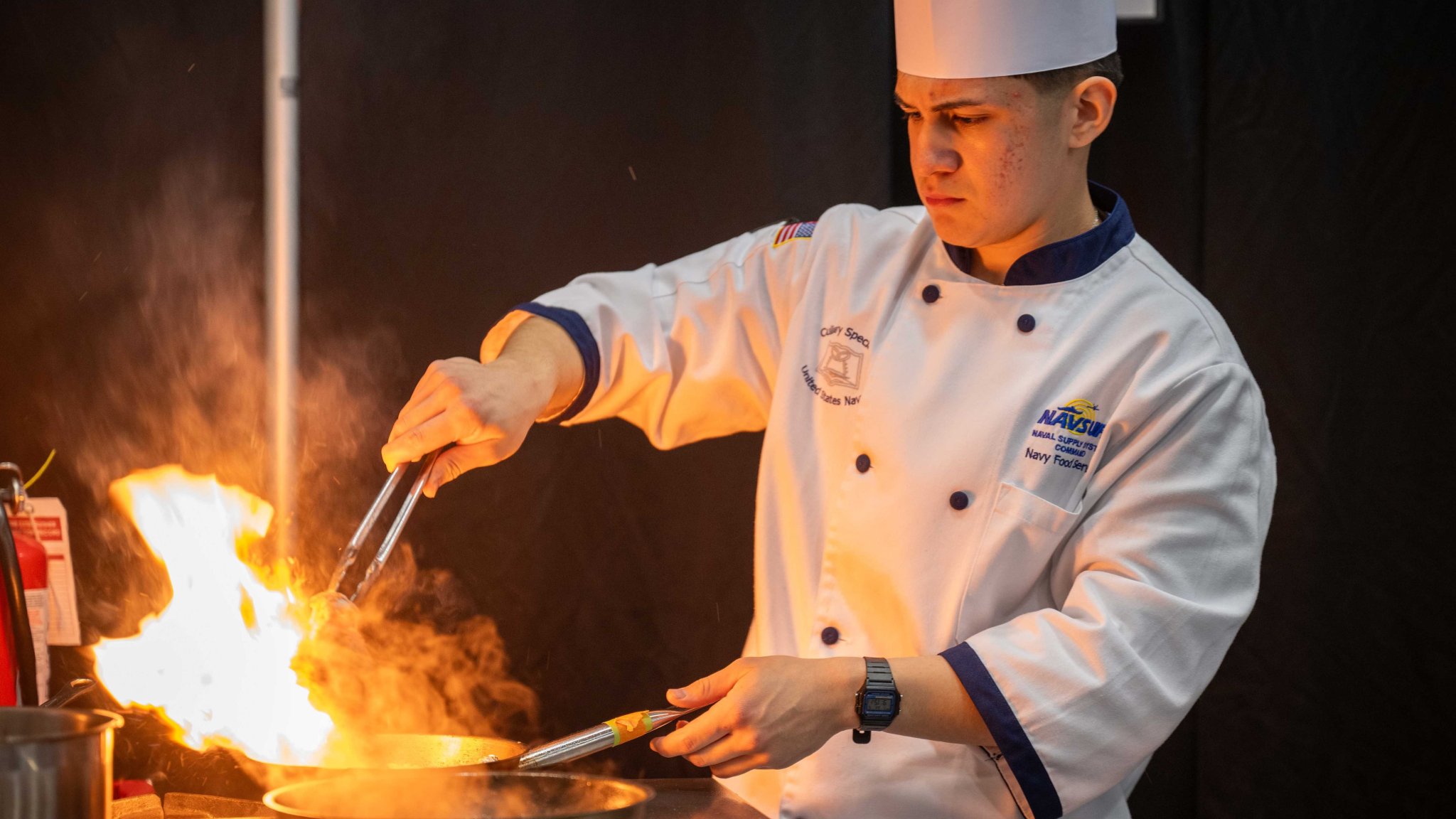 FORT GREGG-ADAMS, Va. – Culinary Specialist Seaman Alejandro Escobar competes in the Student Chef of the Year event as part of team U.S. Navy during the 49th Joint Culinary Training Exercise (JCTE) held at Fort Gregg-Adams, Virginia, March 5th, 2025. The JCTE is an annual event showcasing culinary talent across all components of the Department of Defense and is the largest American Culinary Federation-sanctioned competition in North America. (U.S. Navy photo by Brett Dodge)