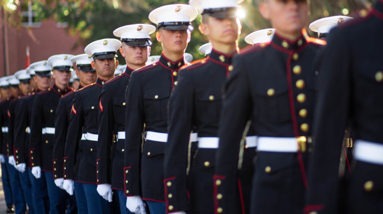 Marines with Delta Company, 1st Marine Training Battalion, march to the Peatross Parade Deck in their Dress Blues aboard Marine Corps Recruit Depot, Parris Island, SC, Dec. 2, 2022. The Marines have spent the last 13 weeks learning close-order drill, marksmanship, martial arts, and Marine Corp traditions. (U.S. Marine Corps photo by Lance Cpl. Blake Gonter)