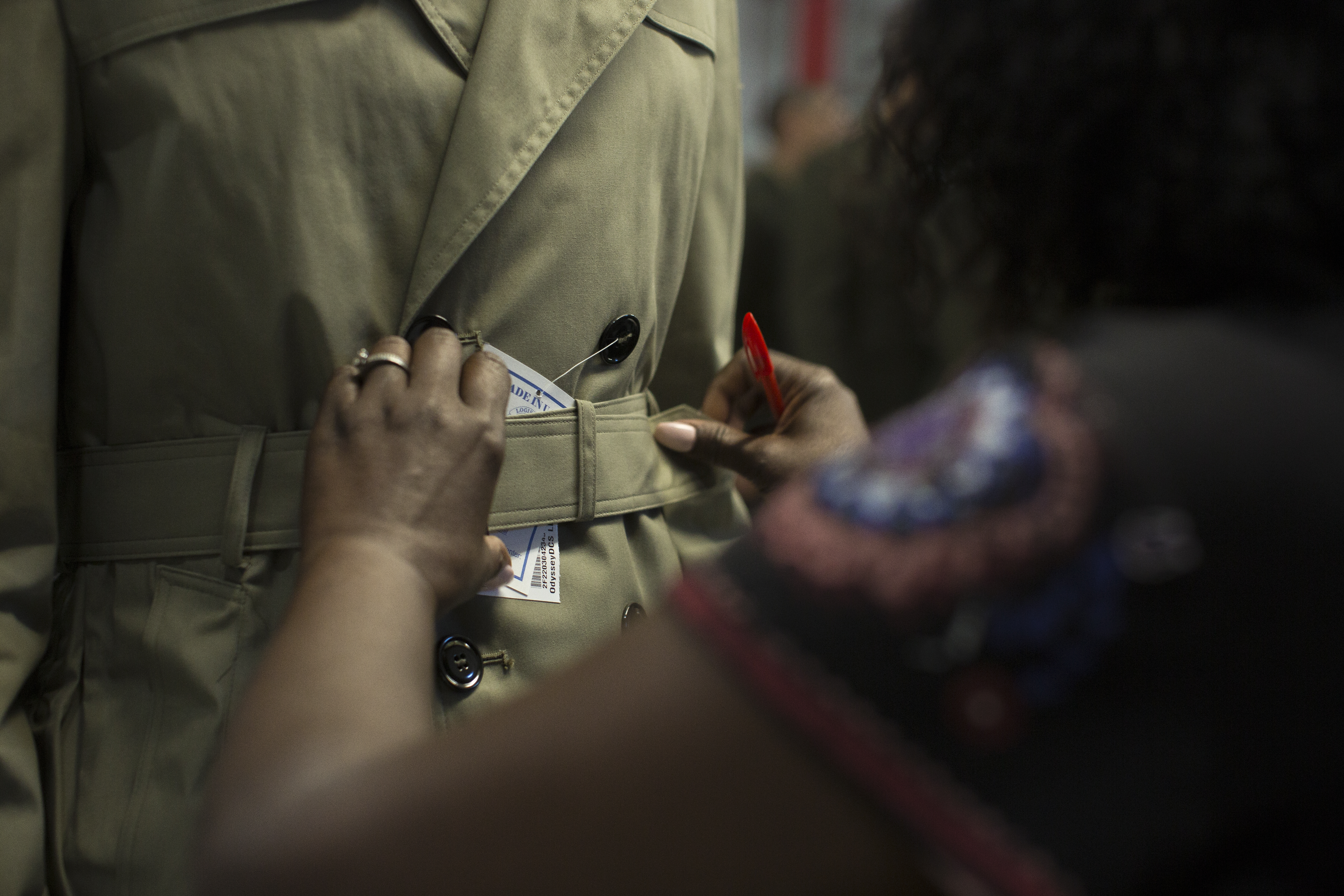 U.S. Marine Corps Rct. Davis Peters, with Platoon 2086, Hotel Company, 2nd Recruit Training Battalion, has his All-Weather Coat tailored at Marine Corps Recruit Depot Parris Island, S.C., Aug. 29, 2018. Recruits receive a standard clothing issue during recruit training. (U.S. Marine Corps Photo by Lance Cpl. Yamil Casarreal)