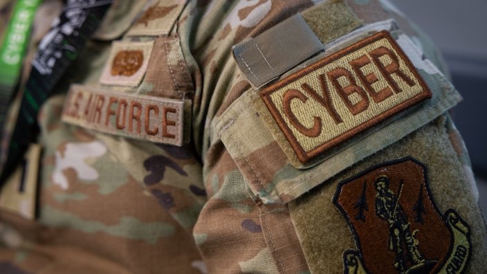 An Air Force uniform with the job tab "CYBER."