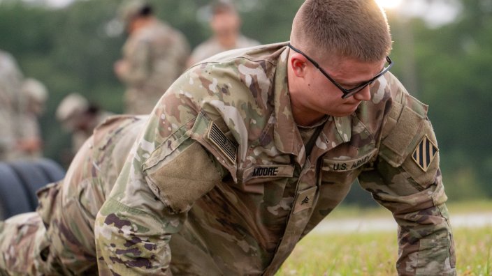 U.S. Army Sgt. William Moore, a cavalry scout with the 6th Squadron, 8th Cavalry Regiment, 2nd Armored Brigade Combat Team, 3rd Infantry Division, performs a hand-release pushup during the 2025 Gainey Cup Best Scout Squad Competition at Fort Benning, Georgia, April 28, 2025. Squads face a series of demanding challenges designed to evaluate their tactical mobility, surveillance capabilities, and teamwork under pressure. (U.S. Army photo by Spc. Luciano Alcala)