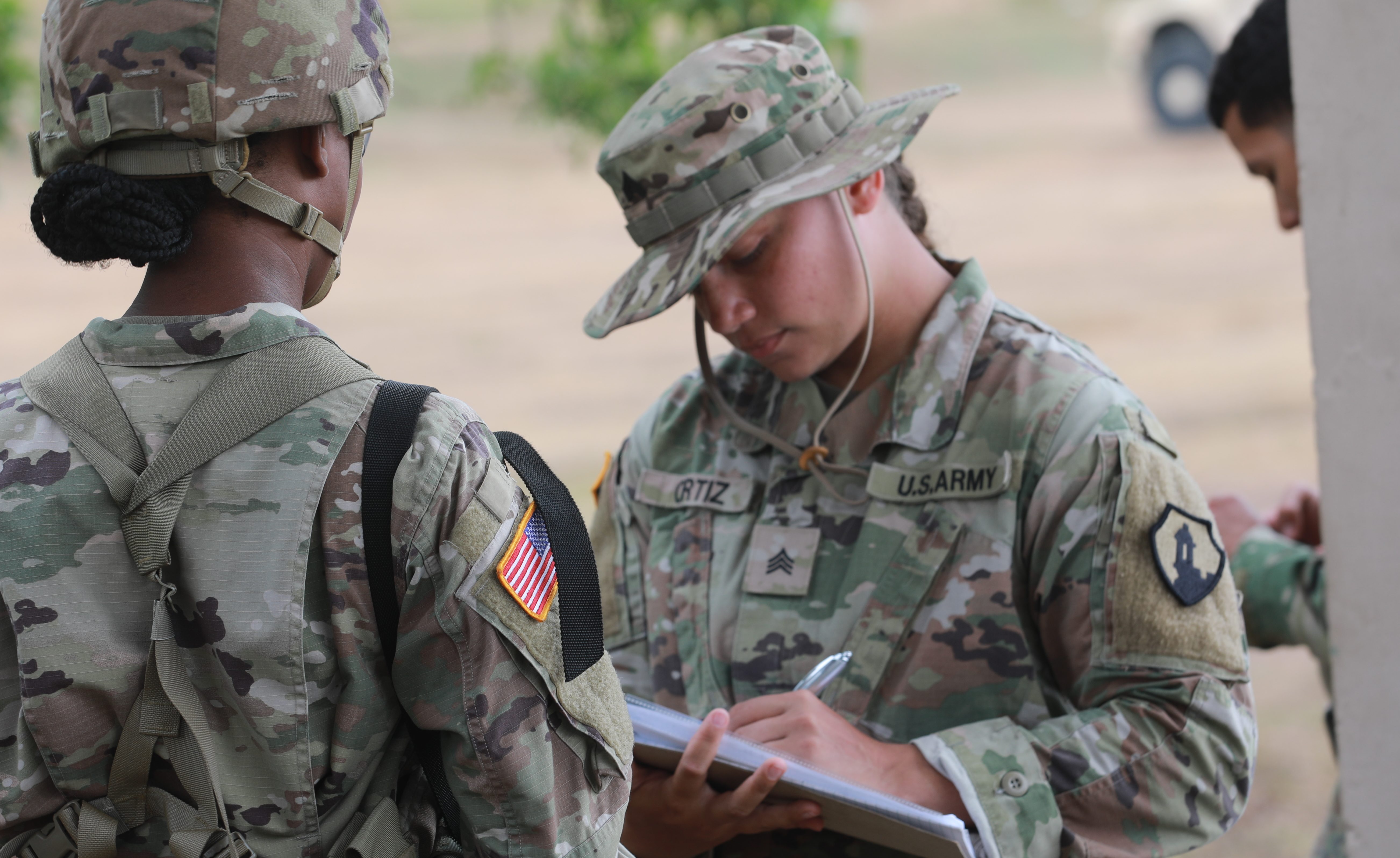 U.S. Army Reserve Sgt. Ortiz assigned to the 301st Military Police Company, 1st Mission Support Command (1st MSC), assigns firing lanes to U.S. Army Soldiers during the Individual Weapons Qualification Caribbean Thunder 25, in Camp Santiago, Salinas, Puerto Rico, Aug. 2, 2025. Approximately 1,100 military personnel across eight (8) locations are participating in Caribbean Thunder 25. (U.S. Army Reserve photo by Staff Sgt. Miguel Miolan)