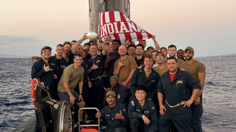 The crew of the USS Indiana fast-attack submarine snapped a celebratory photo after the Indiana Hoosiers won the college football national championship Monday night.