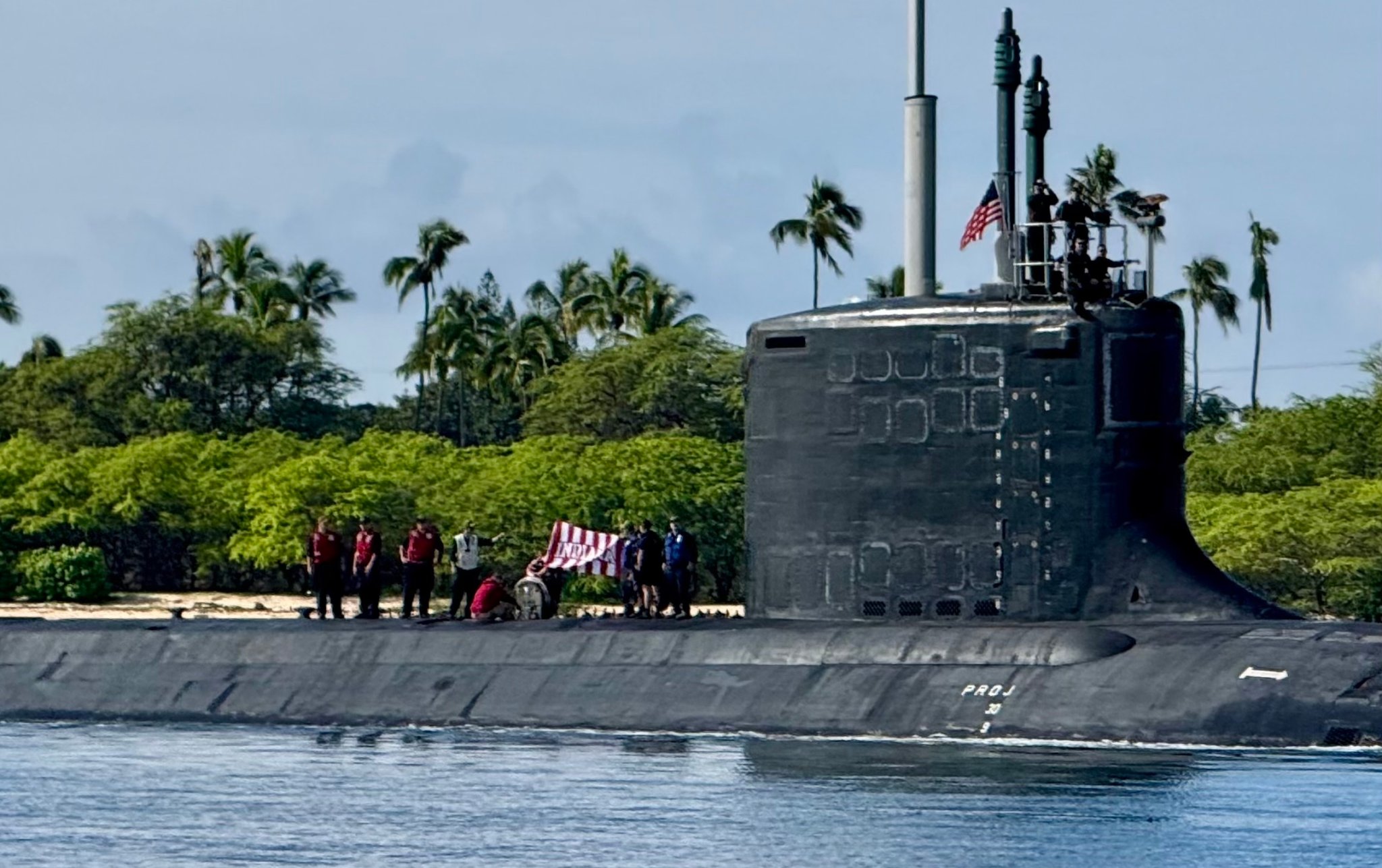 The crew of the USS Indiana unfurl their Hoosier-theme Indiana flag at Pearl Harbor, Hawaii earlier this year.