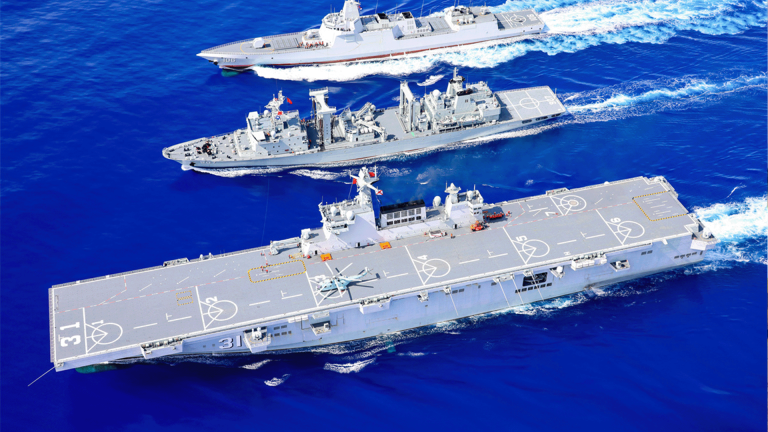 Chinese PLA Navy ships, including the Hainan, sail together in excercises.