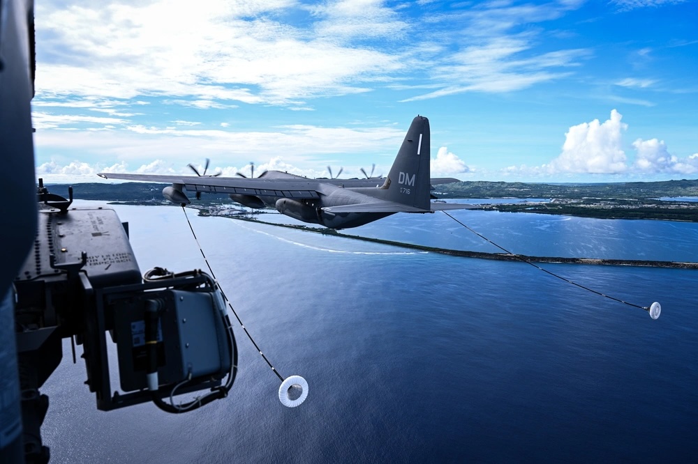 An HC-130J Combat King II aircraft performs air-to-air refueling for two HH-60W Jolly Green II helicopters from the 563rd Rescue Group during exercise Resolute Force Pacific in Saipan, Northern Mariana Islands, July 20, 2025.