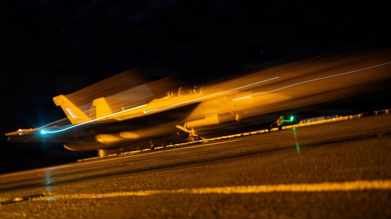 An F/A-18F Super Hornet aircraft, attached to Strike Fighter Squadron 213, launches from the flight deck of the world’s largest aircraft carrier, Ford-class aircraft carrier USS Gerald R. Ford (CVN 78), while underway in the Caribbean Sea, Dec. 28, 2025. U.S. military forces are deployed to the Caribbean in support of the U.S. Southern Command mission, Department of War-directed operations, and the president's priorities to disrupt illicit drug trafficking and protect the homeland. (U.S. Navy photo)