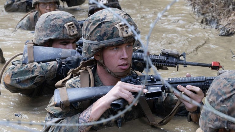 U.S. Marines with 9th Engineer Support Battalion (9th ESB), 3rd Marine Logistics Group, creep through muddy pool while completing the endurance course as a part of the Basic Jungle Skills Course (BJSC) at Jungle Warfare Training Center, Camp Gonsalves, Okinawa, Japan, Dec. 15, 2023. The training taught Marines to successfully navigate through dense marsh and vegetation, rappel down steep cliffs, establish a patrol base and better their knowledge of patrolling and defensive operations. 9th ESB completed the BSJC to mentally and physically operate in harsh jungle environments. (U.S. Marine Corps photo by Lance Cpl. Aaliyah Hunt)
