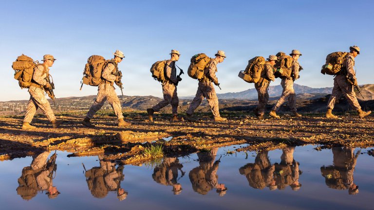 U.S. Marines with Headquarters Company, 5th Marine Regiment, 1st Marine Division participate in a company hike at Marine Corps Base Camp Pendleton, California, Nov. 26, 2025. The purpose of the hike was to test physical readiness and improve combat conditioning. (U.S. Marine Corps photo by Sgt. Kyle Chan)
