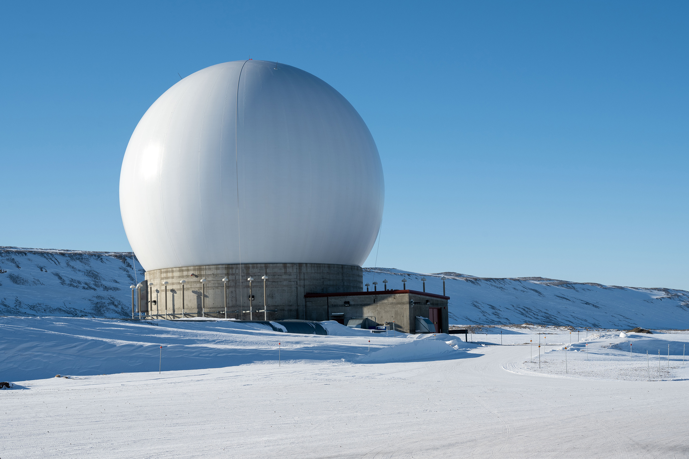 A radar dome belonging to the 23rd Space Operations Squadron Detachment 1 at Pituffik Space Base, Greenland, April 4, 2023. Det. 1 falls under Space Delta 6 - Space Access and Cyberspace Operations. The detachment’s extreme northern location allows contact with polar orbiting satellites 10-12 times per day. (U.S. Space Force photo by Senior Airman Kaitlin Castillo)