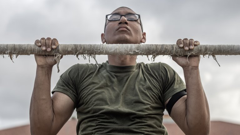 U.S. Marine Corps recruit Raymond Morales Ochoa, a recruit with Mike Company, 3rd Recruit Training Battalion, executes a pull-up during the Physical Fitness Test (PFT) at Marine Corps Recruit Depot San Diego, June 12, 2023. The PFT is performed to evaluate a recruit's level of physical fitness. Morales Ochoa was recruited out of Fort Bend, Texas. (U.S. Marine Corps photo by Lance Cpl. Alexander O. Devereux)